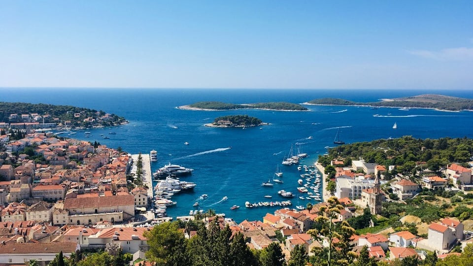 Hvar harbour and yachts for island ferry transfers